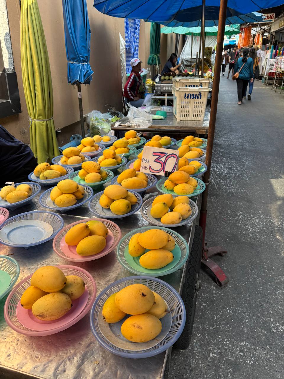 Mango stall at a Bangkok market — 30 THB a plate