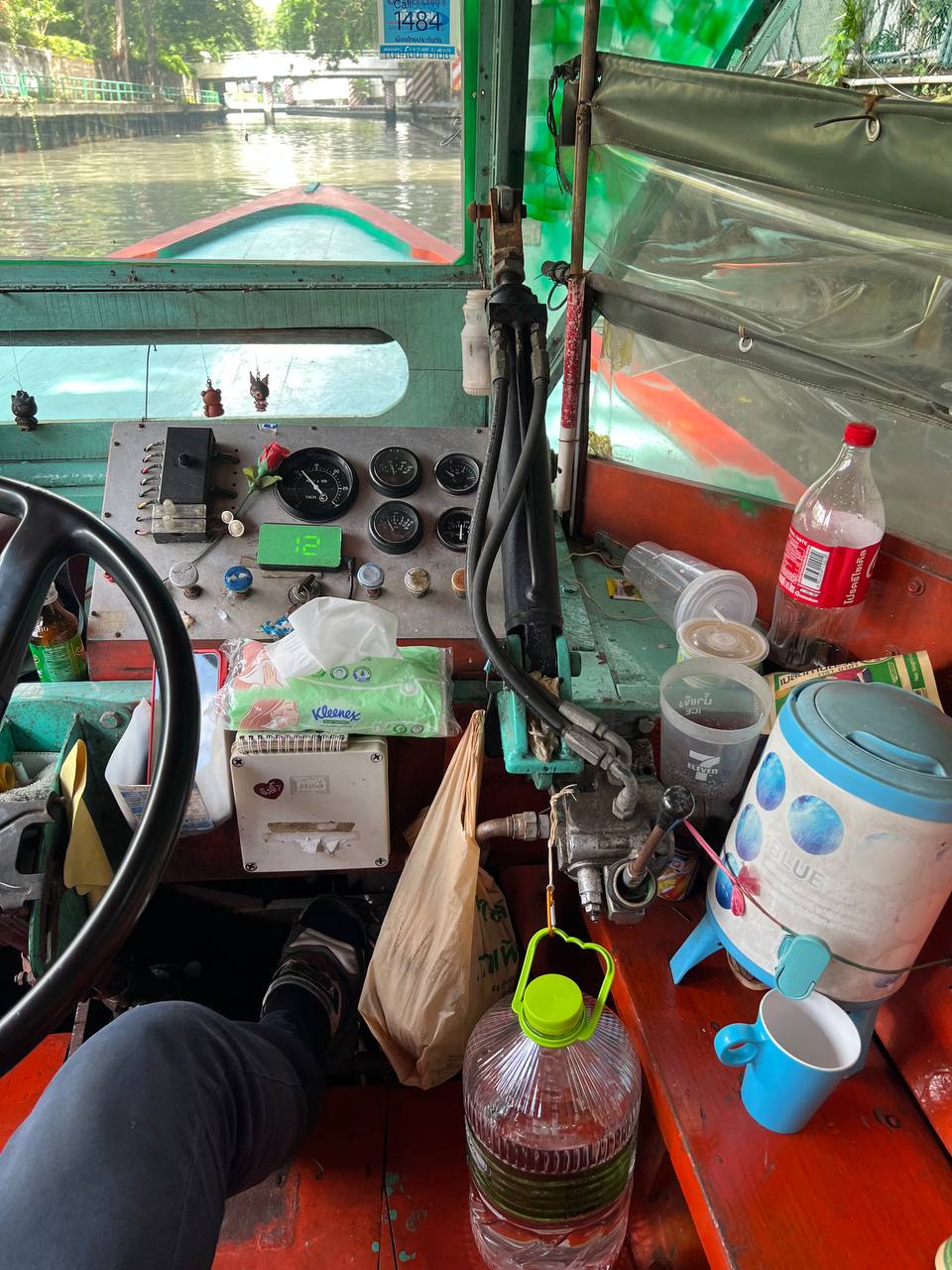 Driver at the helm of a Khlong Saen Saep canal boat