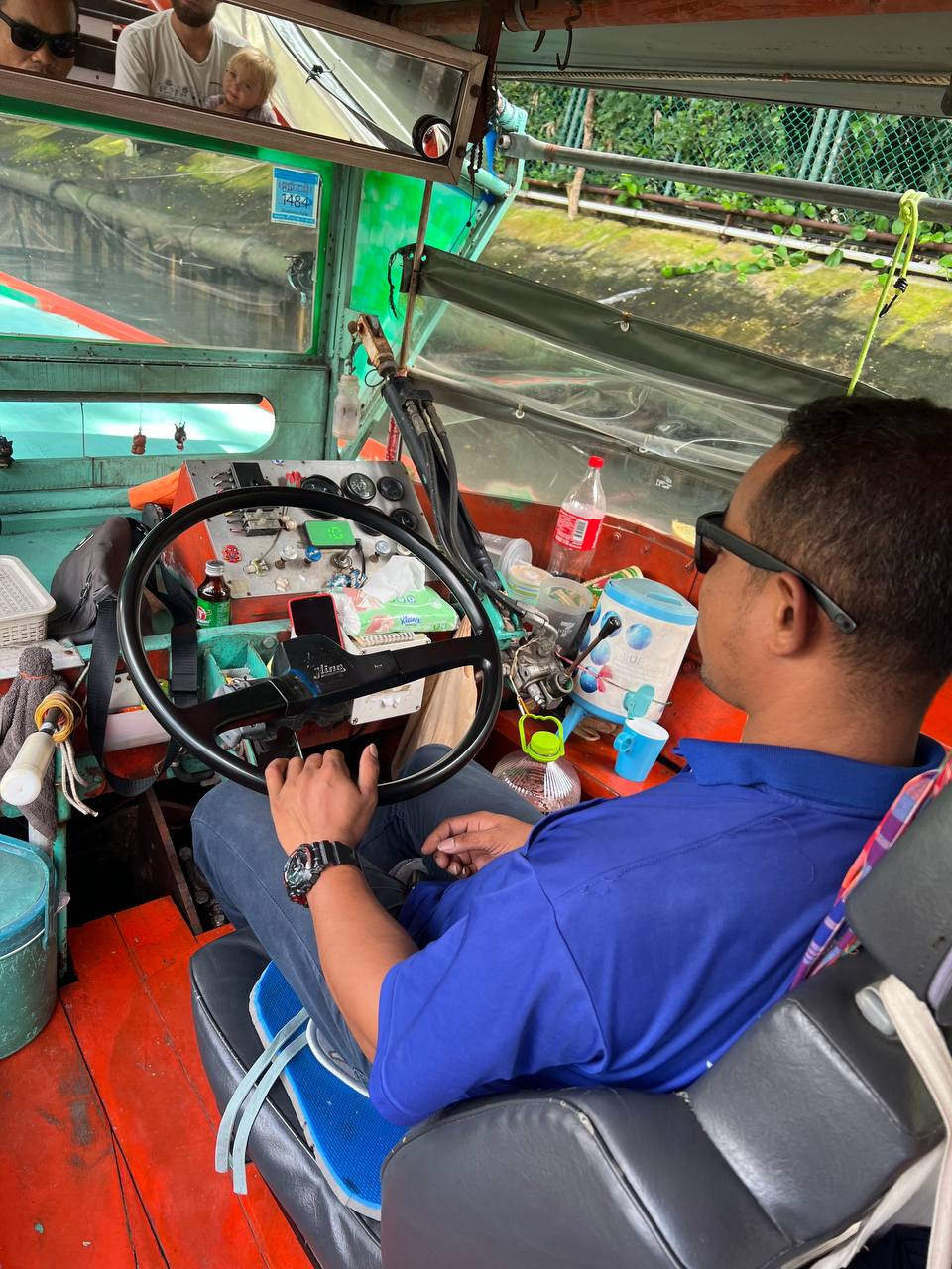 On the Chao Phraya Express Boat — Bangkok waterfront in the background